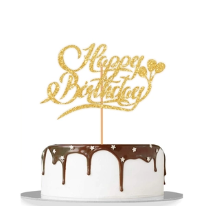 Close-up of golden glitter Happy Birthday cake topper with balloon design on white background