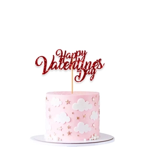 Close-up of glitter red Happy Valentine's Day cake topper with festive pink cake