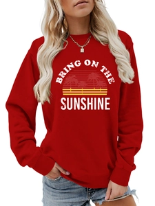 Detail of red sweatshirt showing Bring On The Sunshine print and ribbed cuffs