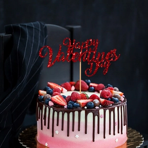Red glitter Happy Valentines Day cake topper on a decorated strawberry chocolate cake