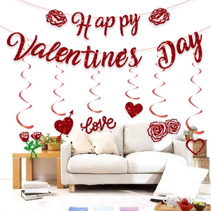 Red glittery Happy Valentine's Day banner with heart hanging swirls and rose cake toppers