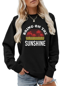 Detail of Bring On The Sunshine graphic print on black crewneck sweatshirt