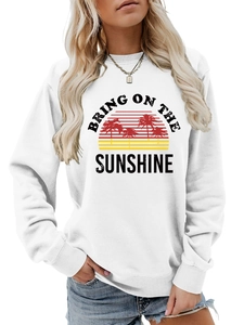 Detail of Bring On The Sunshine slogan and palm tree print on white cotton sweatshirt