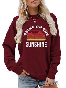 Detail of burgundy crewneck sweatshirt featuring Bring On The Sunshine sunset print