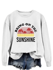 Detail of white crewneck sweatshirt with retro sunset and palm tree graphic print