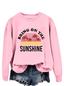 Detail of pink crewneck sweatshirt with 'Bring On The Sunshine' sun and palm tree print