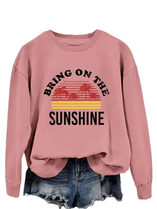 Detailed view of Bring On The Sunshine graphic print on pink crewneck sweatshirt
