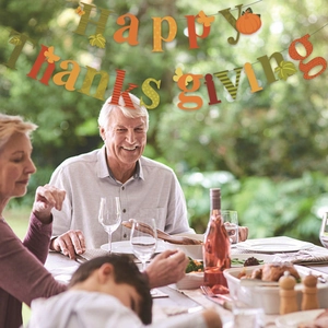 Happy Thanksgiving banner with pumpkin and maple leaf patterns for autumn party decor