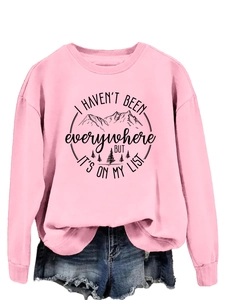 Close-up of pink crewneck sweatshirt with mountain print and ribbed cuffs detail