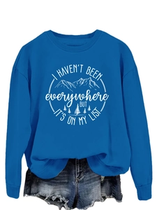 Detail of royal blue crewneck sweatshirt with white mountain and quote graphic print