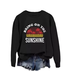 Black crewneck sweatshirt with vintage Bring On The Sunshine sunset and palm tree graphic