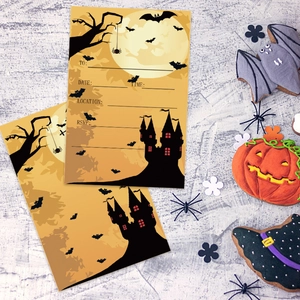 Halloween party invitation cards with ghost and castle theme on orange background