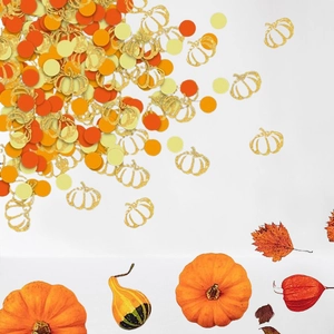 Thanksgiving party confetti with golden glitter pumpkins and orange harvest paper circles
