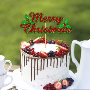 Topper per torta Merry Christmas glitterato rosso e verde con agrifoglio su torta alla fragola