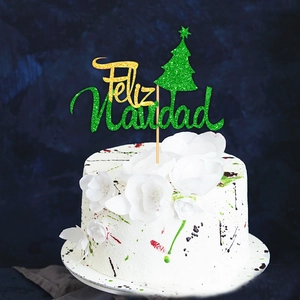 Sparkly Feliz Navidad cake topper with a green Christmas tree on a festive white cream cake