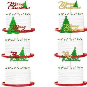 Close-up of Merry Christmas cake toppers with glitter letters and green holiday tree