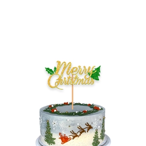 Topper dorato Merry Christmas per torta con agrifoglio su una torta natalizia blu