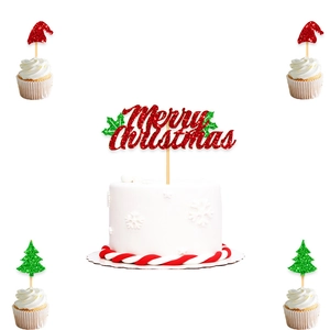 Glittery Merry Christmas cake toppers set with red hats and green trees on cupcakes