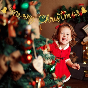 Golden glittery Merry Christmas banner banner with bells for festive holiday decoration
