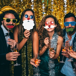 Festive Christmas party photo booth props with paper masks and hand-held sticks
