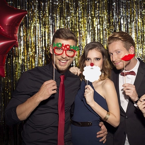 Christmas party photo props set featuring paper glasses and Santa beard on sticks