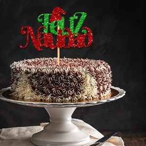 Glittery Feliz Navidad cake topper with red Santa hat for Christmas party decoration