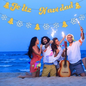 Glittery gold Feliz Navidad banner and snowflake bunting for Christmas party decoration