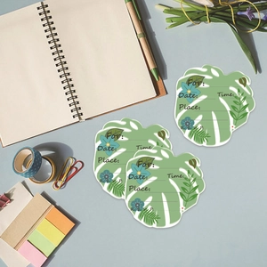 Monstera leaf Hawaiian party invitation cards with floral accents and writing prompts
