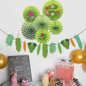 Hawaiian party decoration set with flamingo paper fans and tropical leaf banners on wall