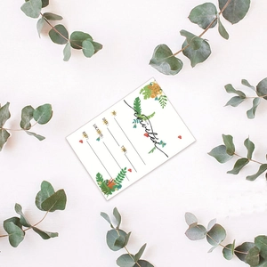 Tropical leaf design invitation card with YOU'RE Invited text on white cardstock