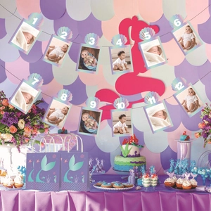 Iridescent mermaid birthday photo banner with shell frames and matching purple gift bags