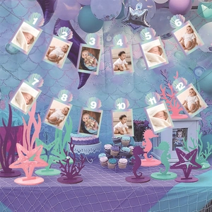 Mermaid party decoration kit with shell photo banner and glittery marine table standees