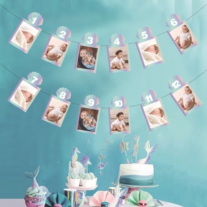 Holographic ocean theme first birthday photo banner with 12 months shell frames