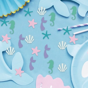 Ocean theme party confetti with mermaid tails starfish and seashells for decorations