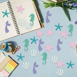 Pastel mermaid theme confetti with seahorse and starfish for ocean party decorations
