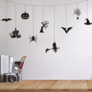 Halloween party wall hanging set with black silhouettes of pumpkins, bats and spiders