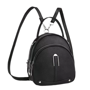 Stylish black pebble leather mini backpack for women featuring silver U-shaped metal hardware