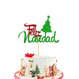Sparkling Feliz Navidad glitter cake topper with green Christmas tree on festive cake