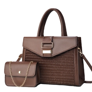 Brown woven handbag set with large tote and mini chain bag featuring gold square buckles