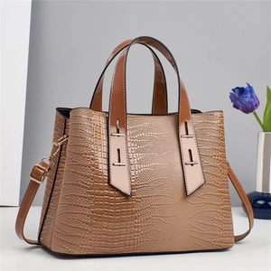 Brown crocodile pattern tote bag with top handles and adjustable shoulder strap