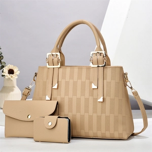 Three-piece women handbag set in light coffee featuring embossed geometric textures and gold hardware
