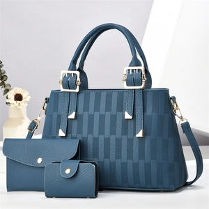 Three-piece dark blue tote bag set with pebble faux leather and gold metal buckle hardware