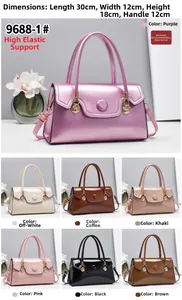 Detail of glossy patent leather handbags in seven colors with luxury metal pendants