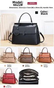 Litchi texture leather handbag 26x12x20cm with internal zip compartments and charm