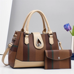 Close-up of vintage striped tote bag with leather trim and matching small wallet