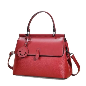 Deep red lychee grain leather tote bag with smile charm and metal handle