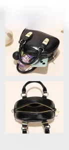 Mini black PU leather handbag showing interior capacity for phone and cosmetics
