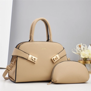 Detail view of apricot pebbled PU leather tote bag set with golden hardware and accessories
