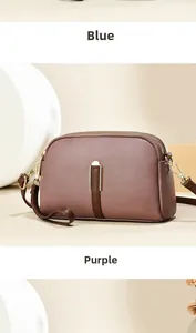 Detail van de dubbele ritssluiting op de luxe crossbodytas met litchi-patroon
