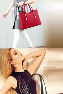 Dettaglio della borsa tote in pelle rossa a grana con eleganti finiture dorate